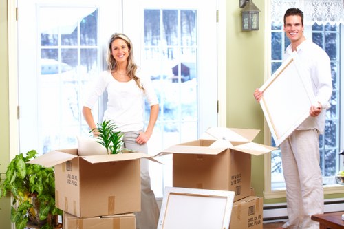 Careful packing of fragile household items for a Temple relocation